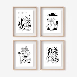 May include: Set of four black and white line art prints featuring women in various poses with plants and other elements. The prints are framed in simple wooden frames.