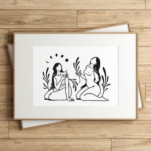 May include: Black and white line art print of two figures sitting with their backs to each other. The figures are surrounded by stylized plants and a crescent moon with five circles.