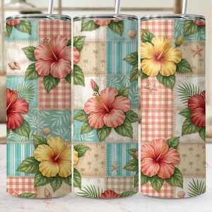 May include: A set of three stainless steel tumblers with a floral design. Each tumbler features a patchwork pattern with hibiscus flowers, seashells, and starfish. The color palette includes coral, yellow, and teal.