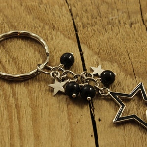 Bijou de sac étoile, porte-clés étoile noire, cadeau étoile, porte-clé étoile argentée, cadeau sur le thème étoile, étoiles argentées, jolie breloque de sac, breloque de sac noir, étoile