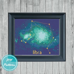 May include: A cross-stitch pattern of the Libra constellation, with a blue and green background and yellow stars. The word "libra" is written in yellow at the bottom of the pattern.
