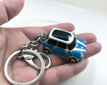 sky blue mini car, Black panoramic roof window, cool, white gold keychain,luxury,best gift，Can Customized Red car headlights and taillights