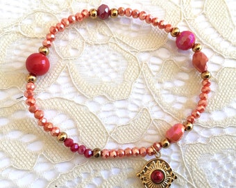 Elastic bracelet tones red, orange, gold, crystal beads, ethnic charm