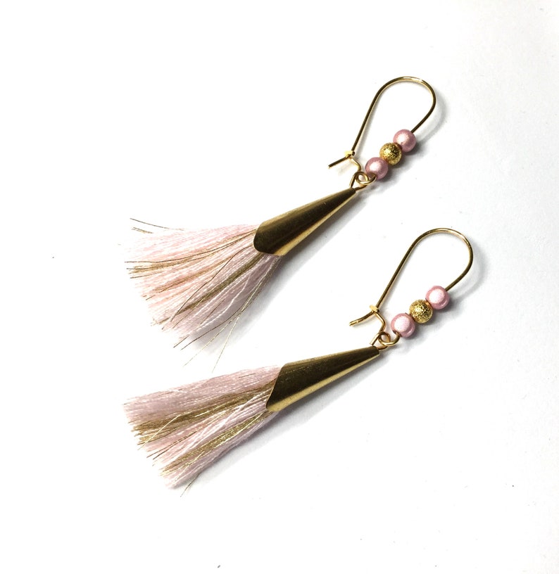 golden and pink earrings pink pompom