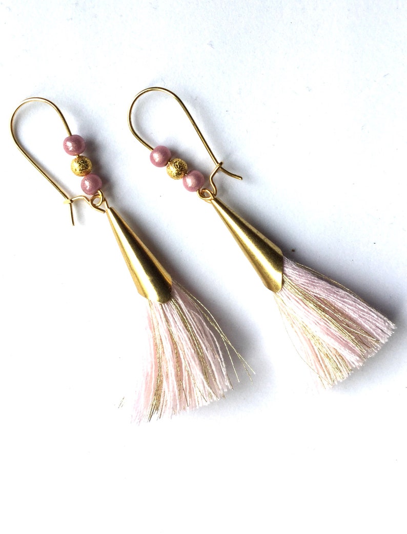 golden and pink earrings pink pompom