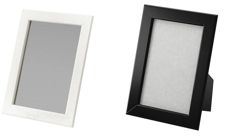 May include: Two picture frames, one white and one black, both with a simple design and a matte finish. The frames are standing upright on a white background.