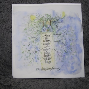 May include: A watercolor painting of a house with trees and a blue sky. The text reads "May the warm winds of heaven blow softly on this house. Cherished Garden Blessing."