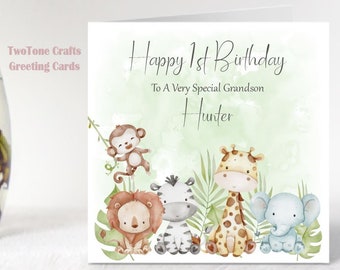 May include: A green and white birthday card with a watercolour design of jungle animals. The card says "Happy 1st Birthday" and "To A Very Special Grandson Hunter".