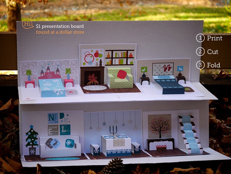 Puede incluir: Un diorama de papel de varios niveles con un tema invernal. El diorama est&aacute; hecho de una tabla de presentaci&oacute;n de 1 &euro; que se encontr&oacute; en una tienda de un euro. El diorama presenta un dormitorio, una sala de estar y una escalera. El diorama est&aacute; decorado con copos de nieve, &aacute;rboles y otras decoraciones de tem&aacute;tica invernal. El diorama est&aacute; etiquetado con las instrucciones "Imprime, corta, dobla".