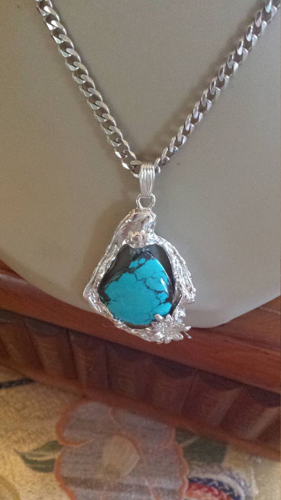 Turquoise sterling silver pendant with sterling si