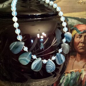 One strand beaded faceted opalite and bluish green onyx teardrops