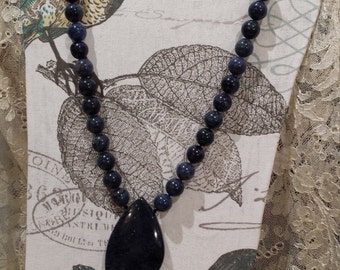 One strand beaded necklace with drop