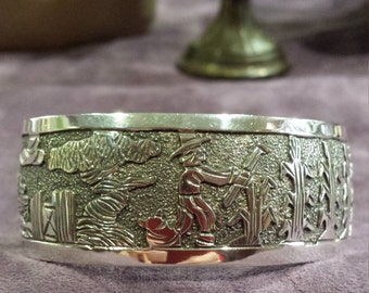 Sterling silver story teller cuff bracelet