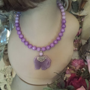 Purple faceted jade necklace with purple elephant drop pendant