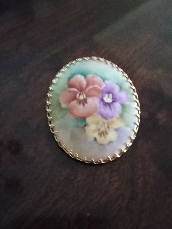 Vintage hand painted porcelain oval floral brooch