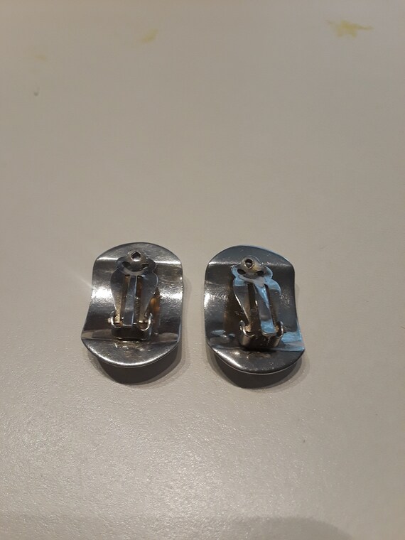 Sterling silver curved clip on earrings with decorative engraving View 5