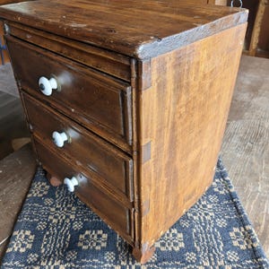 Antique  primitive rustic Old world wooden Three drawer footed chest dovetail joinery, ceramic white knobs, footed, spice holder, farmhouse