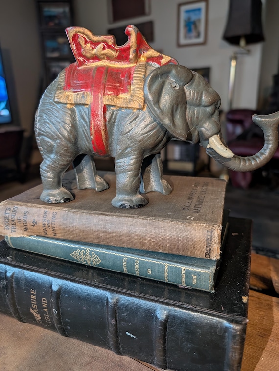 Vintage cast iron mechanical circus elephant coin bank, figurine elephant shaped decorative bank.