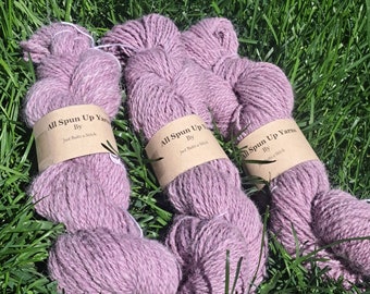 Handspun lilac colored alpaca sport wieght yarn. Hypoallergenic natural yarn.