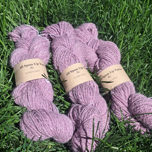 Handspun lilac colored alpaca sport wieght yarn. Hypoallergenic natural yarn.