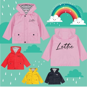 May include: A set of five colourful children's raincoats with personalised names. The raincoats are pink, red, yellow, and blue. The raincoats have a hood and a zip closure. The raincoats are displayed against a green background with a rainbow and clouds.