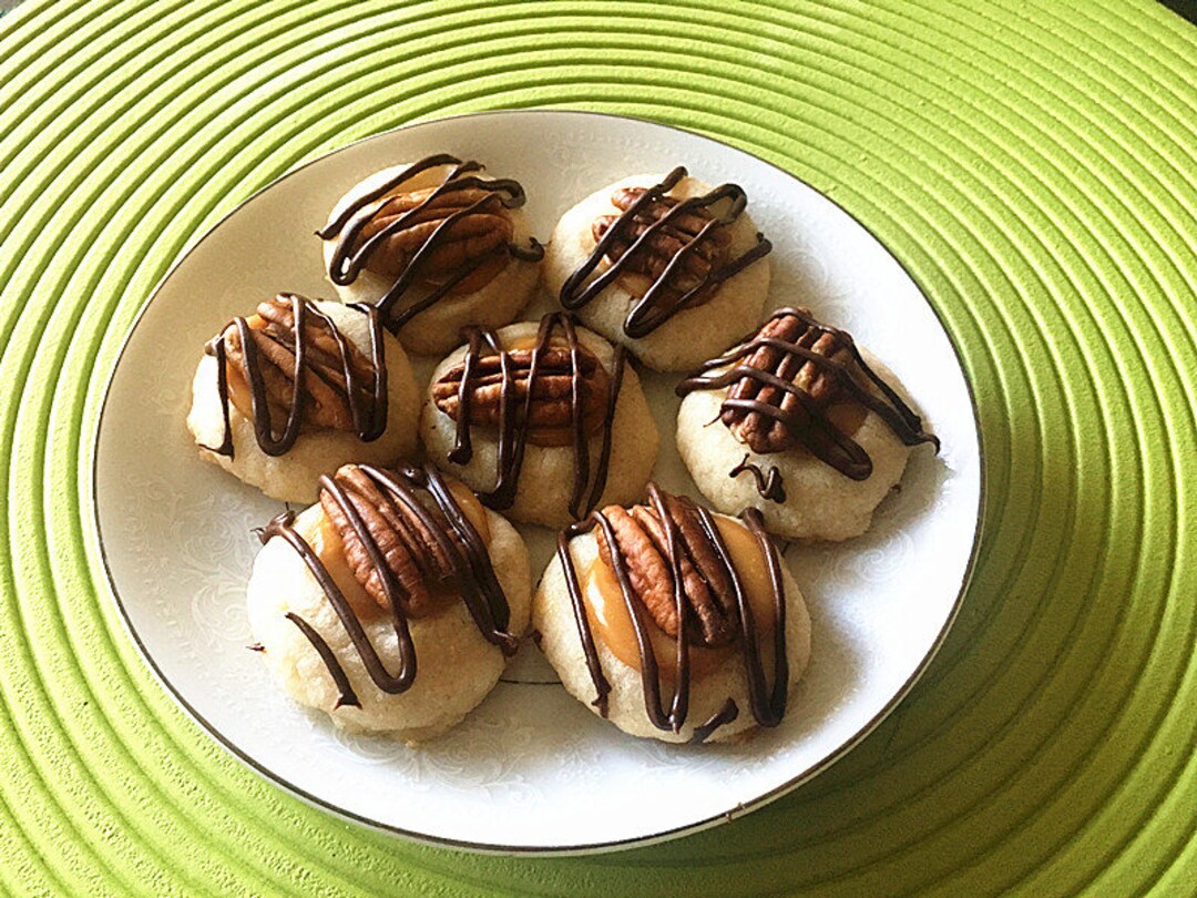 Homemade Almond Flavor Thumbprint Cookies Topped With Caramel and Pecan