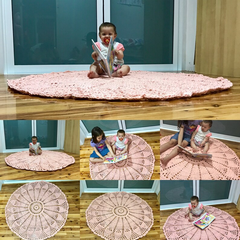 May include: A pink crocheted round rug with a circular pattern in the center. The rug is shown in different rooms with children sitting on it and reading books.
