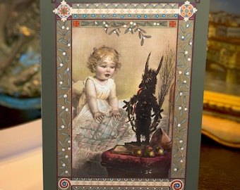 May include: A greeting card with an illustration of a child and a dark figure. The card has a green border with decorative elements. An open white envelope is next to the card on a dark wooden surface.