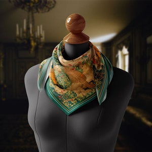 May include: A green, yellow and brown patterned silk scarf with a floral design. The scarf is tied around a mannequin's neck.
