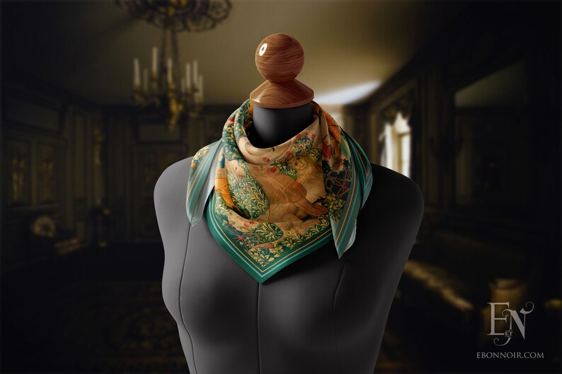 May include: A green, yellow and brown patterned silk scarf with a floral design. The scarf is tied around a mannequin's neck.