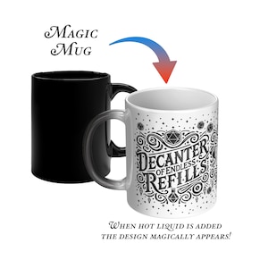 May include: A black and white color-changing mug with a design that appears when hot liquid is added. The design features a stylized illustration of a decanter with the text "Decanter of Endless Refills".