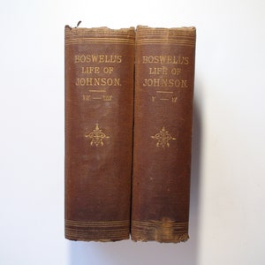 May include: Two brown hardback books with gold lettering on the spines. The books are titled "Boswell's Life of Johnson" and the volumes are VII-VIII and V-VI.