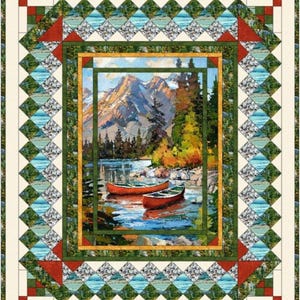 May include: A rectangular quilt featuring a central landscape panel of two red canoes on a lake with mountains and pine trees. The border consists of a diamond-patterned frame in shades of blue, green, and white, accented by red corner squares.