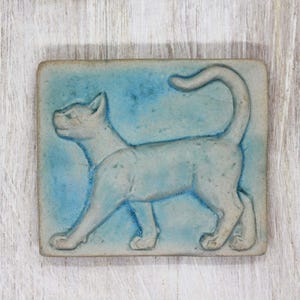 Ceramic tile &quot;Cat&quot; – Handmade relief tile in matte turquoise, 7.9 × 9.1 cm