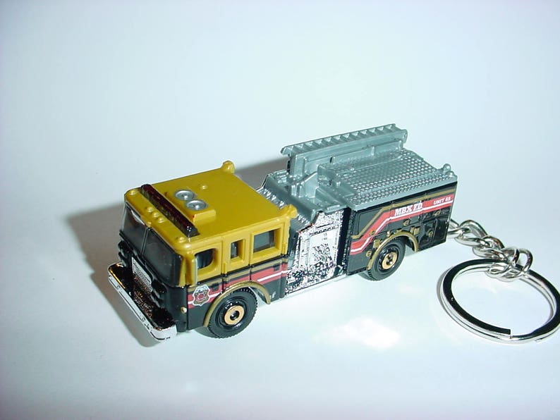 3D Pierce Dash fire engine custom keychain by Brian Thornton keyring key chain finished in blackgold color truck trim rescue 911