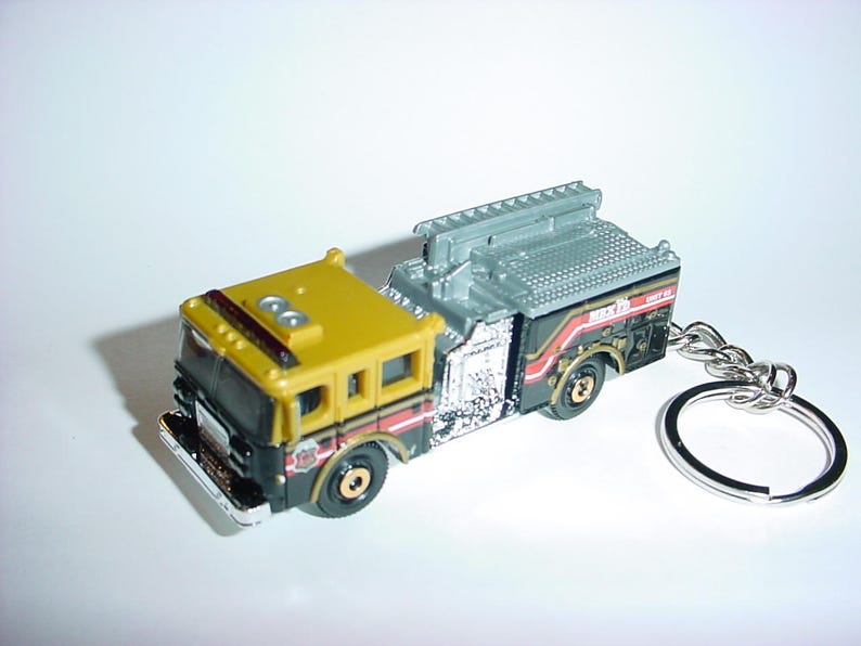 3D Pierce Dash fire engine custom keychain by Brian Thornton keyring key chain finished in blackgold color truck trim rescue 911