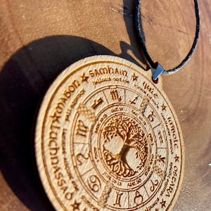 Wheel of the year engraved wooden necklace