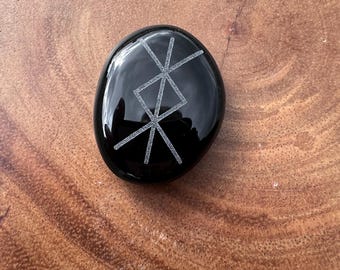 Protection Bind Rune engraved on a Black Obsidian Palm.