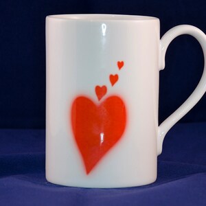 Porcelain mug with red heart design