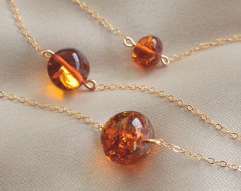 Polished Raw Amber Necklace. Honey colored natural jewelry for her. Smooth globe pebble bead pendant marble. Amber amulet gifts for her.