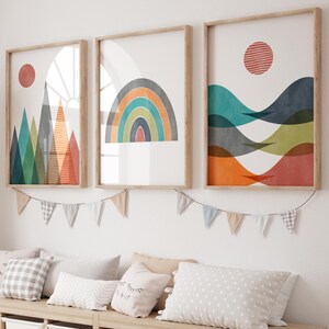 May include: A wooden storage bench with six white bins, featuring a giraffe toy and three framed abstract art prints with geometric shapes and colours, including a rainbow, mountains, and waves.