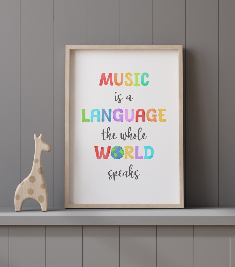 May include: A framed print with the text "MUSIC is a LANGUAGE the whole WORLD speaks" in colorful letters. The word "WORLD" has a small image of the Earth inside the letters.
