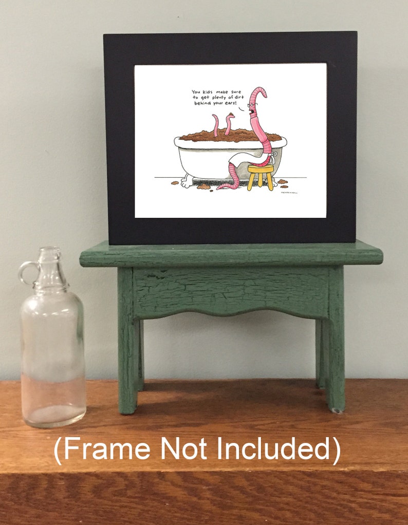May include: A framed cartoon illustration of worms in a bathtub with the caption "You kids make sure to get plenty of dirt behind your ears!" The frame is black and the illustration is on white paper.