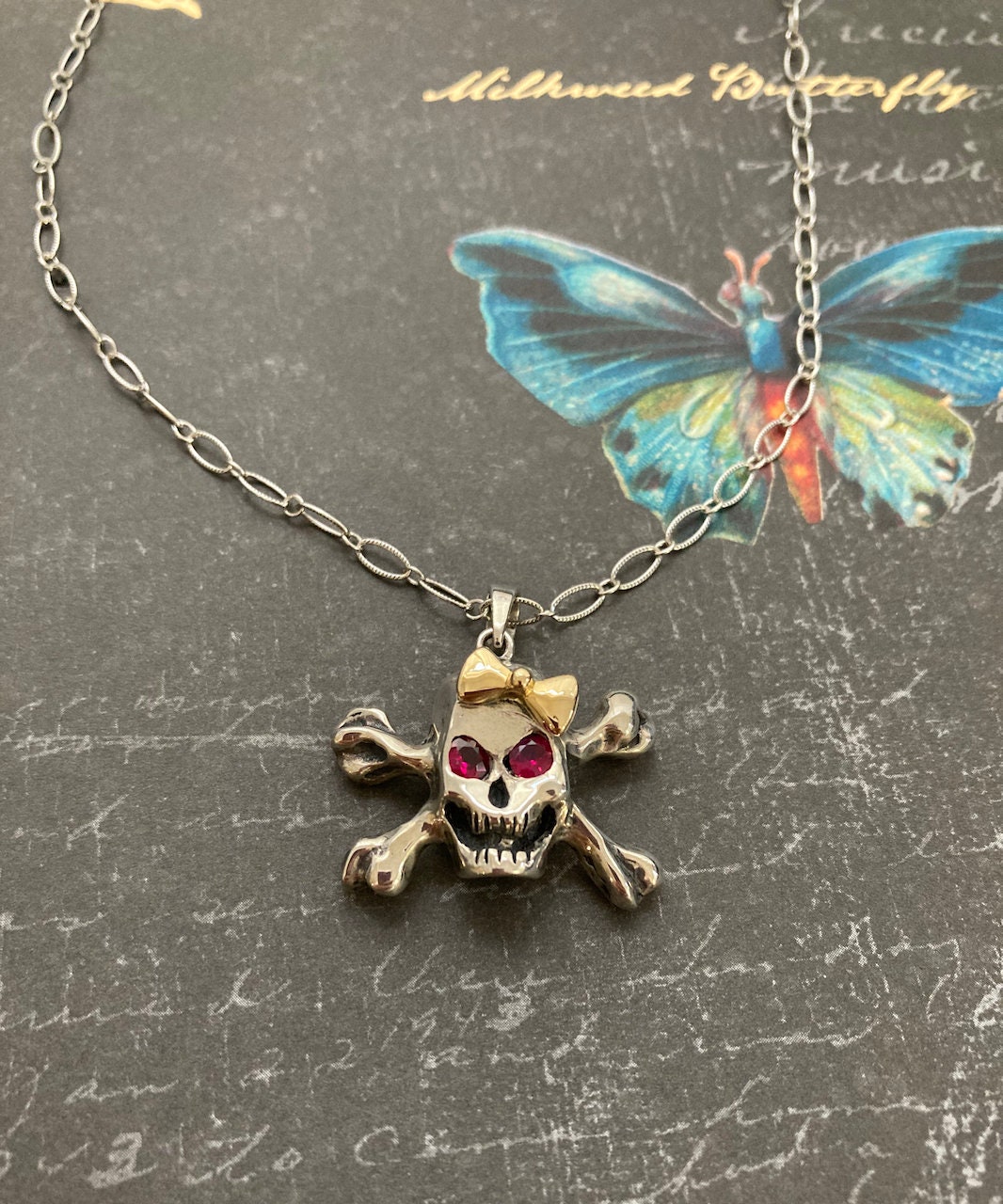 Hello Skully Skull Pendant With Ruby Eyes in Sterling Silver Hello Skully Skull Pendant With Ruby Eyes in Sterling Silver