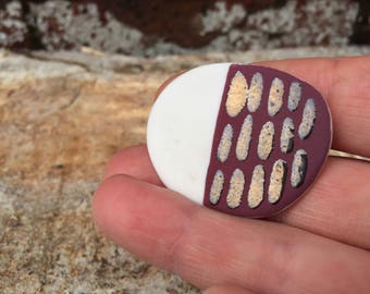 Porcelain Pebble Brooch with purple and gold decoration