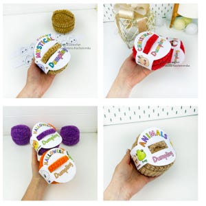 May include: A collection of four sets of crocheted plush dumpling toys, each wrapped in a themed paper band labeled Mystical, Christmas, Halloween, or Animals, featuring colorful yarn textures and printed character illustrations on the packaging.
