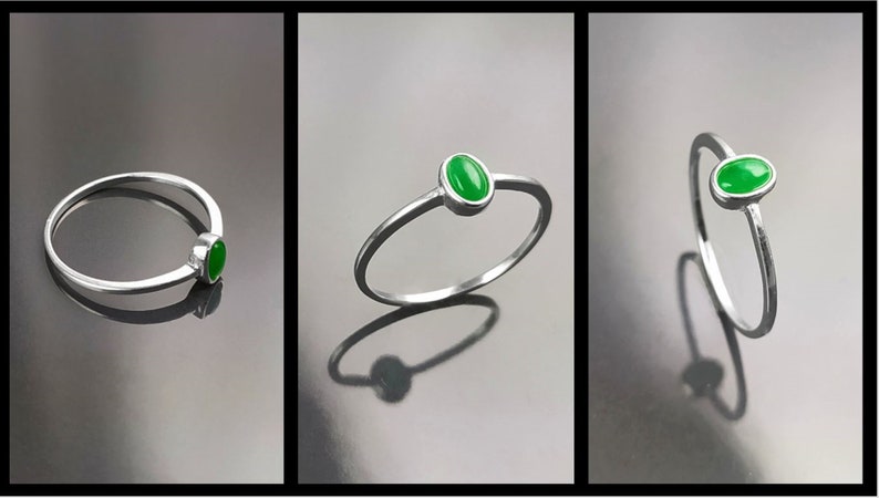 May include: A silver ring with a green oval-shaped gemstone. The ring is shown from three different angles.