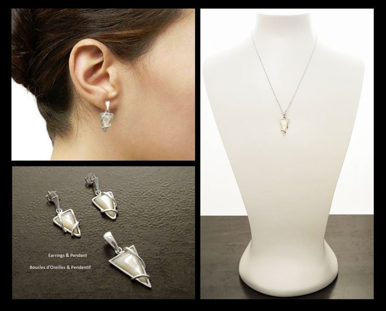 May include: A jewelry set consisting of a pendant necklace and a pair of drop earrings. Each piece features a triangular, iridescent white inlay encased in a silver-toned metal frame. The pendant hangs from a thin chain, and the earrings have posts.