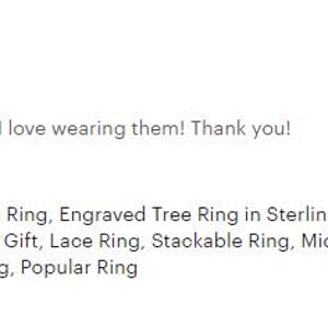 May include: A silver ring featuring a tree of life design. The ring is delicate and dainty, making it a popular choice for bridesmaids or as a gift. The ring is also stackable, offering versatility in styling.