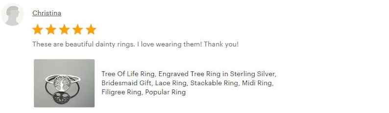 May include: A silver ring featuring a tree of life design. The ring is delicate and dainty, making it a popular choice for bridesmaids or as a gift. The ring is also stackable, offering versatility in styling.
